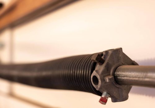 What Causes Garage Door Torsion Spring Replacement?