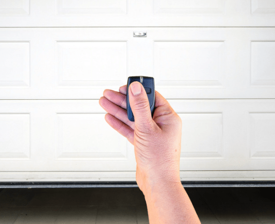 Opening a garage door with a remote. 