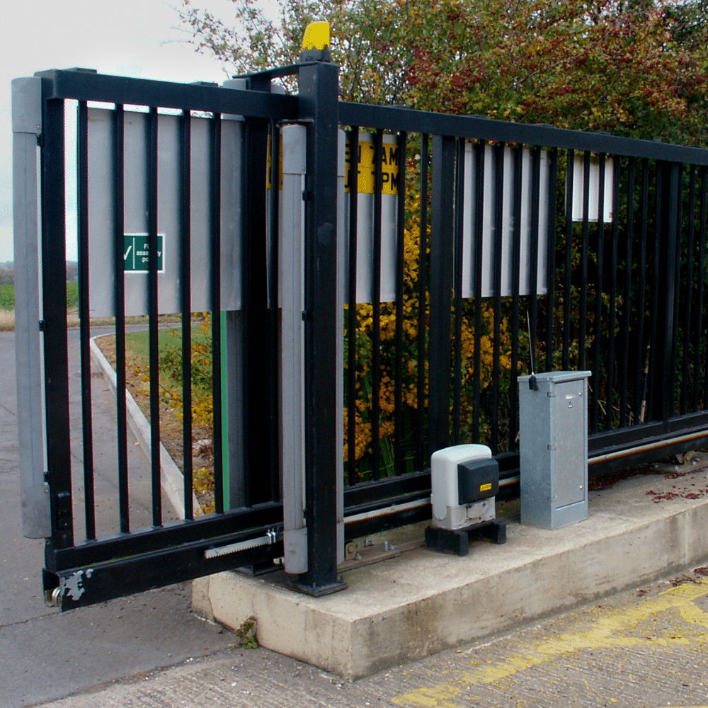 Black sliding security gate with automatic motor.