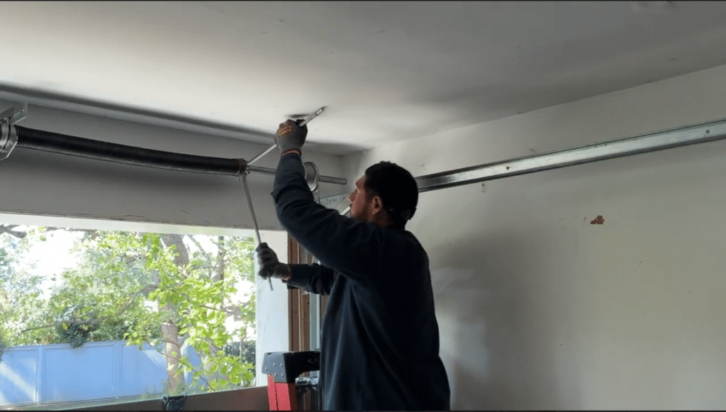 expert repairing garage door springs