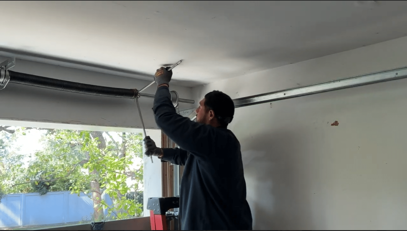 expert repairing garage door springs