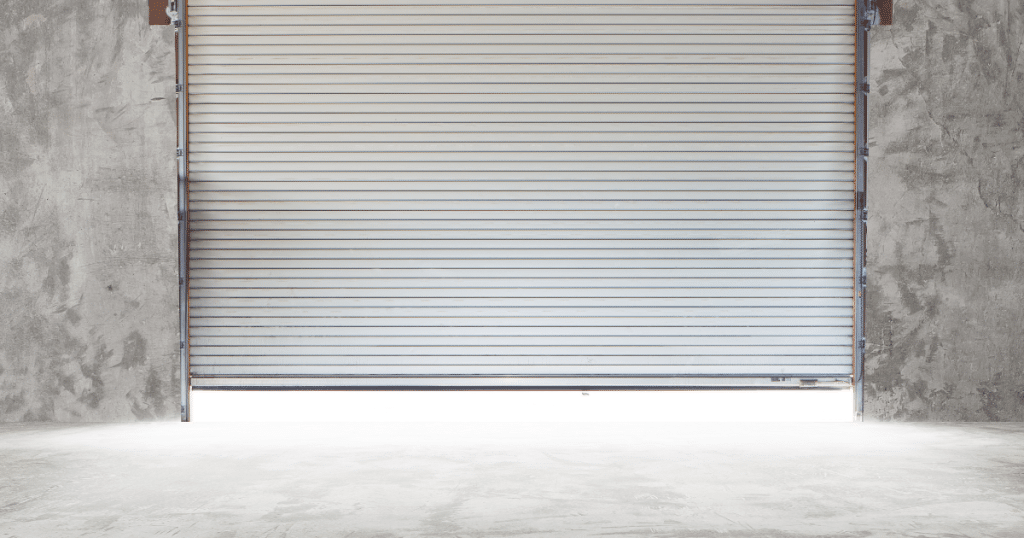 Gray garage door, concrete wall.