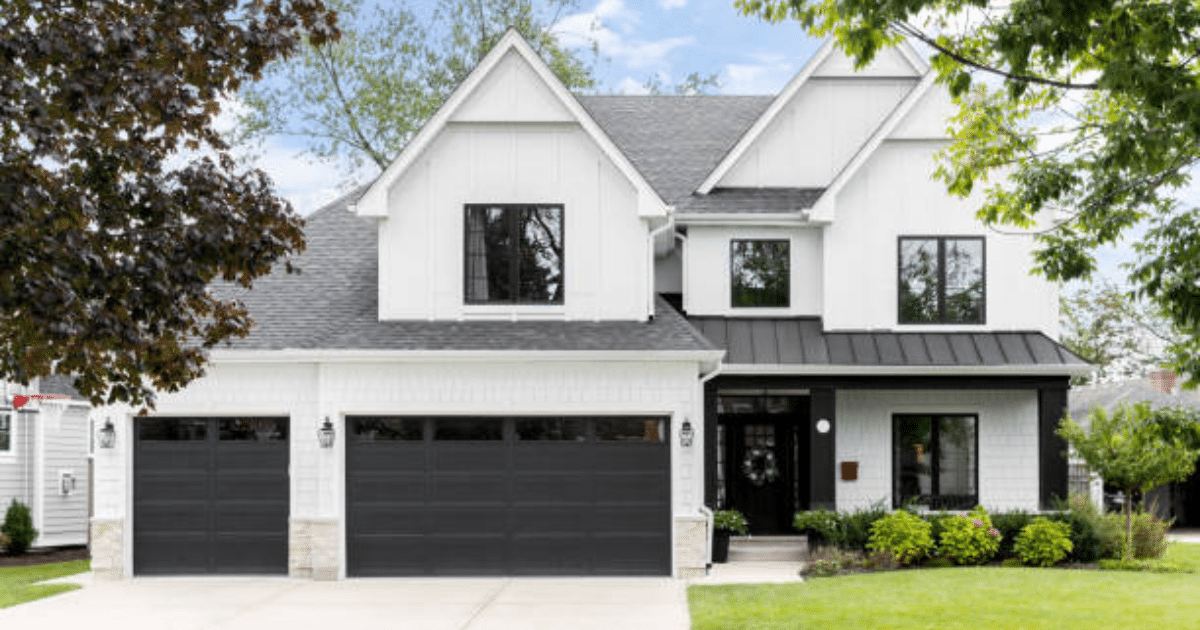 black garage doors on white house