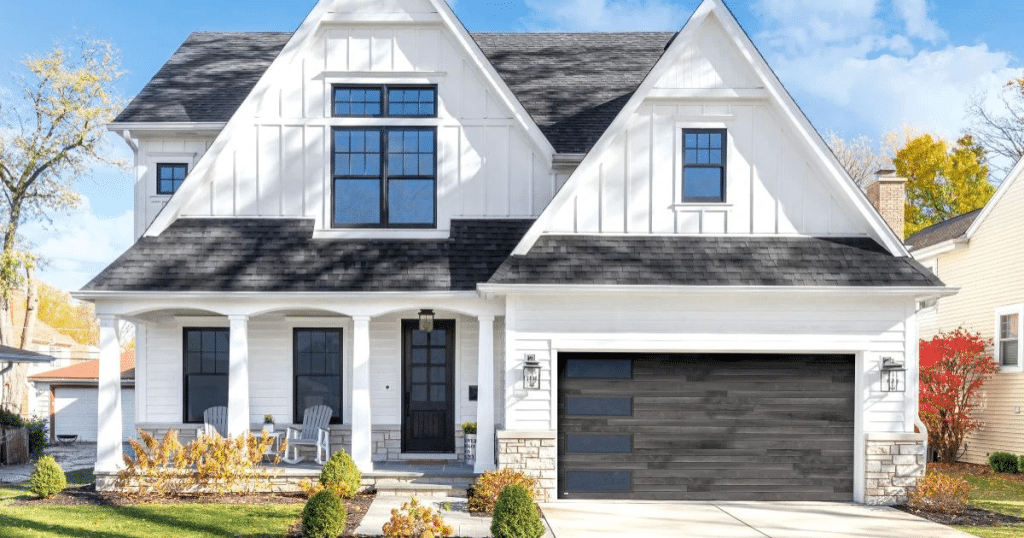 white house with black garage door