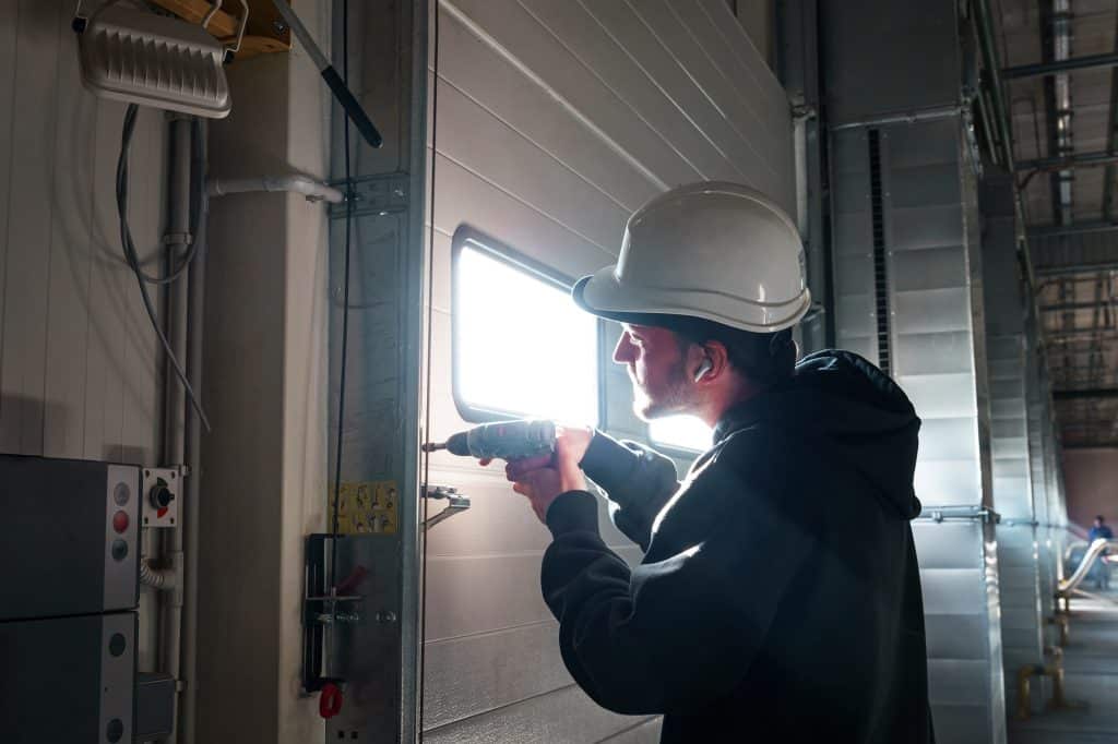 Engineer repairing an unloading gate