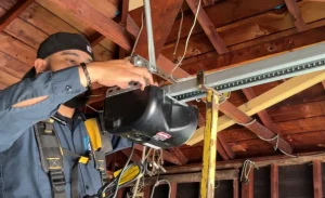 the hands-on process required for a garage door opener repair