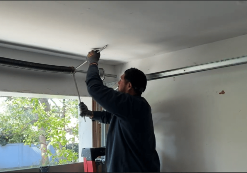 expert repairing garage door springs
